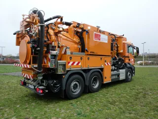 Orange WRS 2 on a meadow, oblique rear view with rear door and side control panels