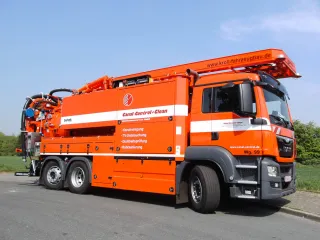 Orange combination vehicle with water recycling in customer livery, side view